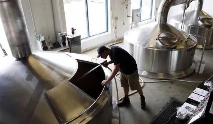 How do breweries use steam boilers?